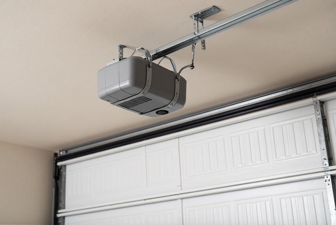 Ceiling-mounted garage door opener on the rail